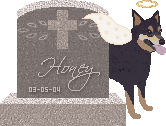 A gravestone with an angel Honey standing next to it